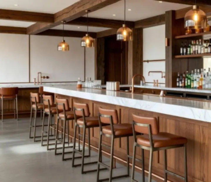 Elegant bar lounge interior at Hearth & Hold'em with softly lit seating and a polished bar