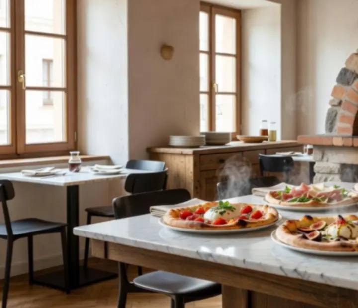 Gourmet woodfired pizzas on a table near the pizza oven at Hearthandholdem