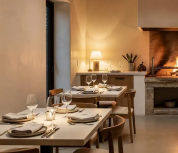 Warm woodfired dining room with intimate tables at Hearthandholdem
